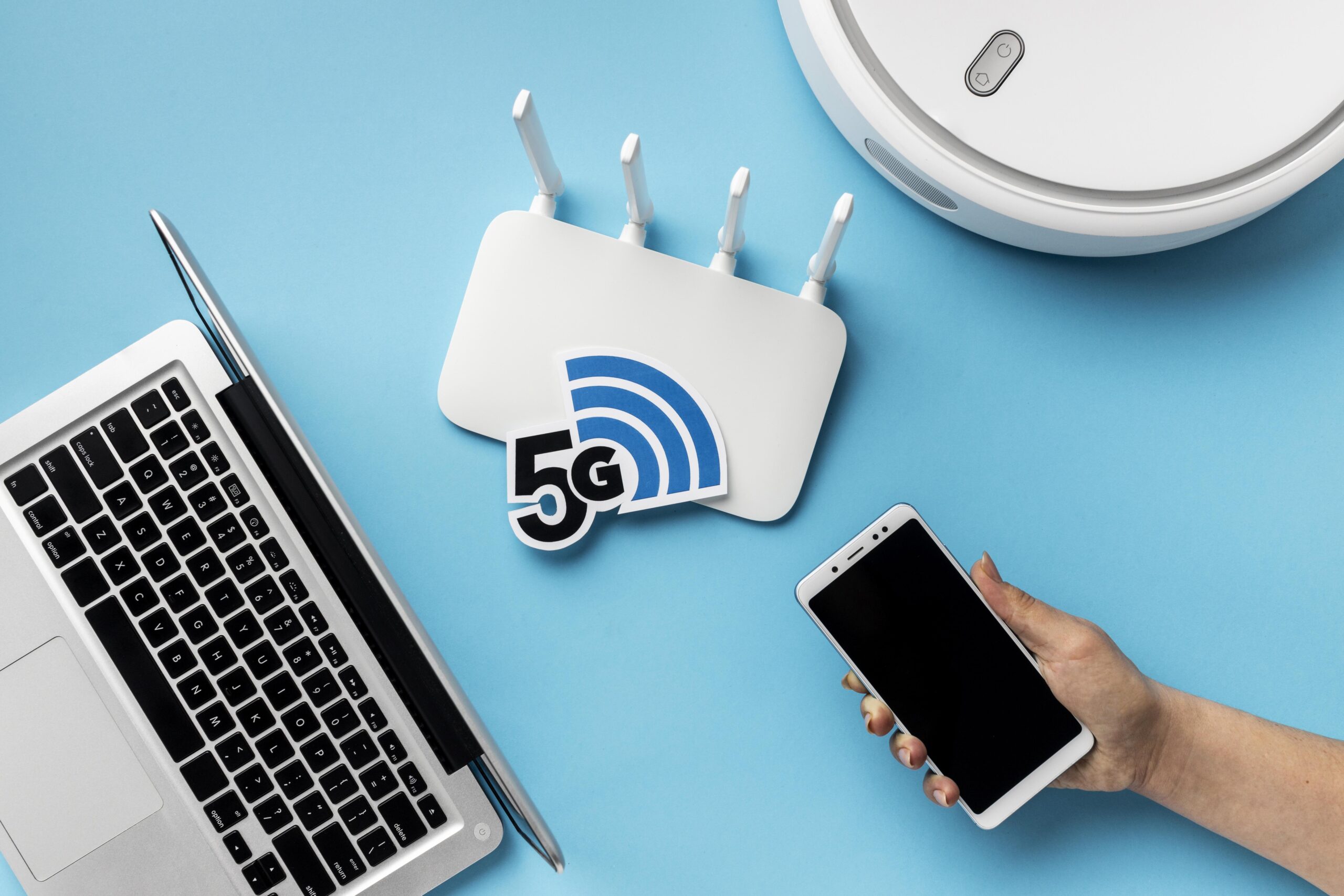 top-view-wi-fi-router-with-laptop-vacuum-cleaner